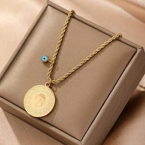 Gold Pendant Necklace with Blue Charm